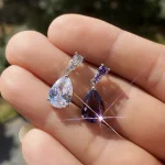 precioso AAA Cubic Zirconia gota de agua encanto mujeres gota pendiente boda joyería blanco/púrpura pendientes de alta calidad 2 precioso AAA Cubic Zirconia gota de agua encanto mujeres gota pendiente boda joyería blanco/púrpura pendientes de alta calidad 2