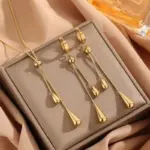 Juego de 3 piezas: collar y pendientes ajustables de acero inoxidable 316L, nuevo modelo de joyería de moda en color dorado para mujer, ideal como regalo para fiestas. 1