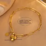 Conjunto de Joyería Dorada de Moda 2026: Collar de Cadena de Eslabones Audaces y Pulsera con Dije de Corazón Brillante – Combinación Clásica para Bodas 2